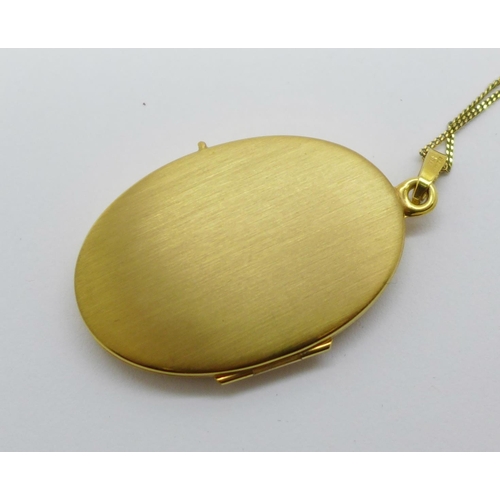 1075 - A 9ct gold locket and chain, 5.6g