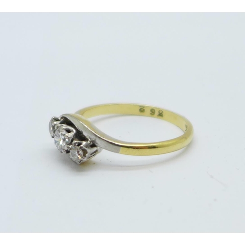 1081 - An 18ct gold, platinum set three stone diamond ring, 2.8g, N, centre stone approximately 0.25 carat