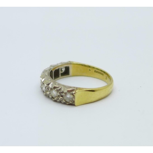 1082 - An 18ct gold and seven stone diamond ring, 4.4g, L