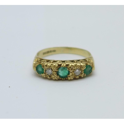 1089 - A 9ct gold, emerald and diamond ring, 2.6g, M