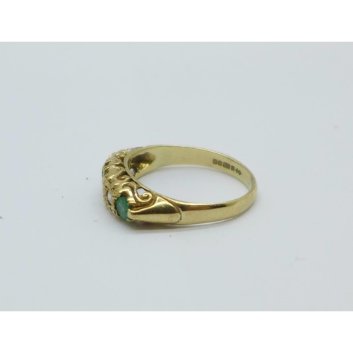 1089 - A 9ct gold, emerald and diamond ring, 2.6g, M