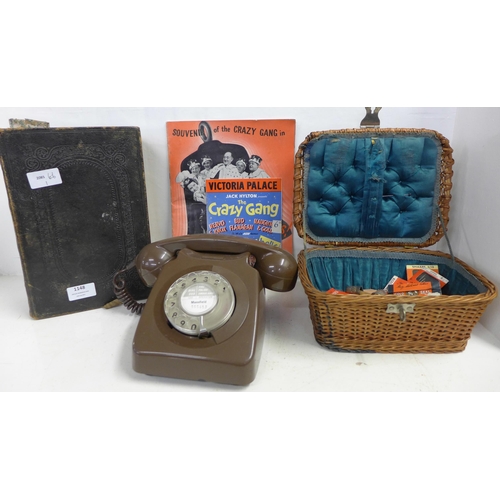 1148 - A Holy Bible, sewing basket with contents, a telephone and two programmes **PLEASE NOTE THIS LOT IS ... 