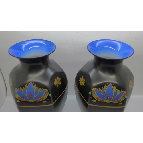 609 - A pair of Crown Ducal vases, 23.5cm