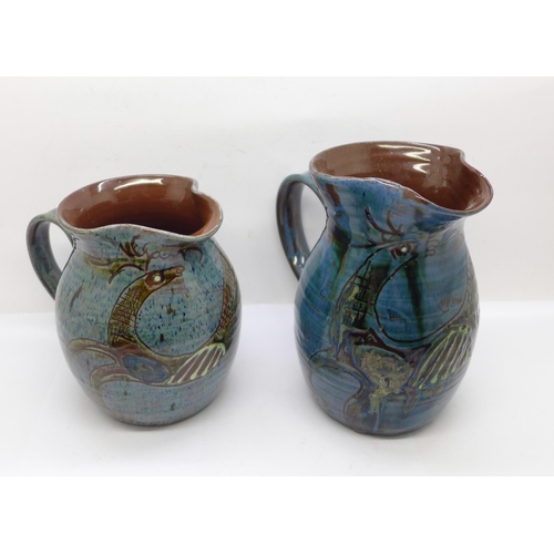 610 - Two studio pottery jugs, signed, L. Stockley, Weymouth