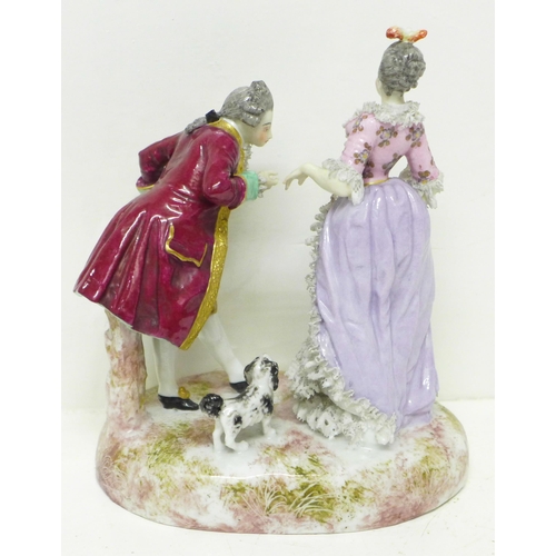 618 - A continental lace porcelain figure group, (lace a/f, thumb on gentleman a/f)