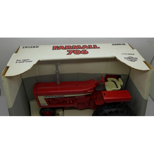 623 - A Farmall 706 die-cast metal tractor by Ertl