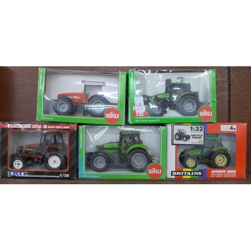 626 - Five model tractors, Siku, Ertl and Britains, boxed