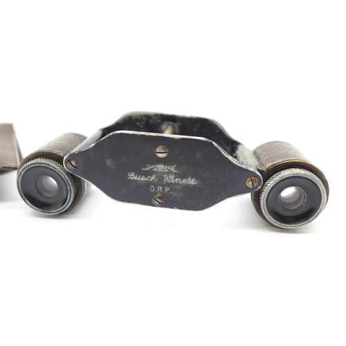 633 - A pair of Busch & Winnett opera glasses, retailed by Asprey