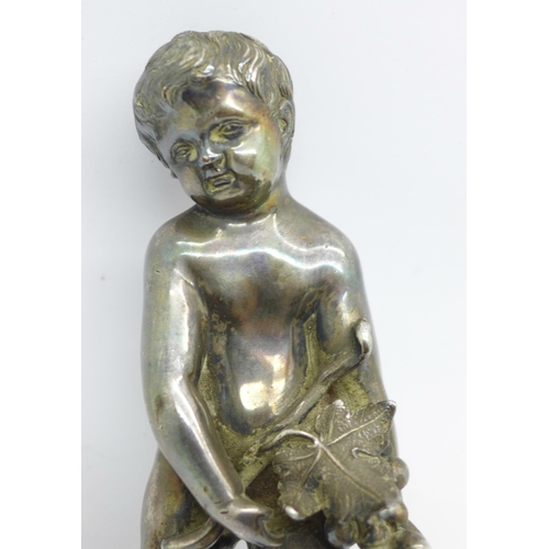 635 - A cast metal figure of a cherub, no base