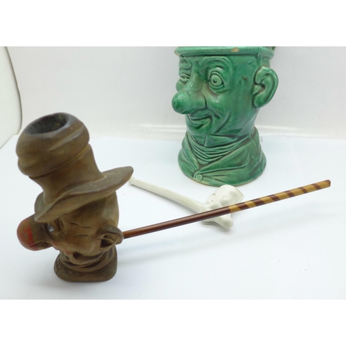 653 - Three Ally Sloper items, a wooden pipe bowl, a clay pipe and a jug, (jug a/f)