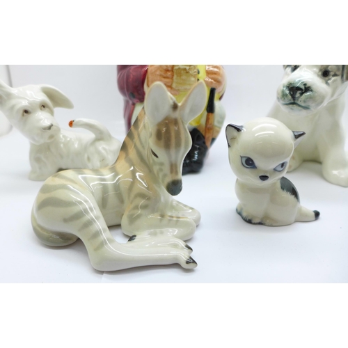 654 - A Russian figure of a dog, a Royal Doulton Jolly Toby, etc. (6)