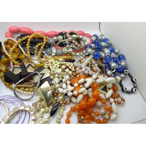 676 - A box of costume jewellery including bangles