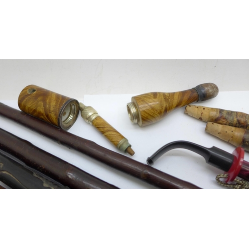 679 - A novelty pipe/champagne bottle, cherrywood and other pipe stems and pipe cases