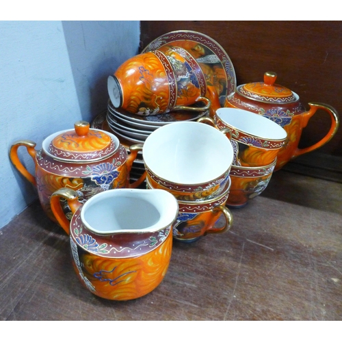 680 - A hand painted Japanese Samurai tea set, lacking one saucer