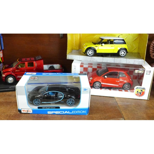 690 - Four model cars, Maisto, Mondo Motors, a Mini and a Road Signature Ford F-650