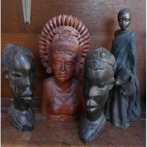 691 - Three carved wooden busts and one other figure