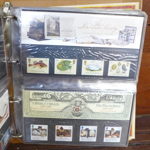 702 - An album of Royal Mail mint stamp packs, 60 in total