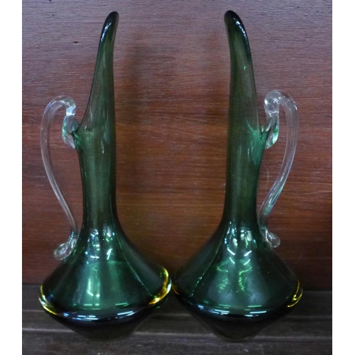 713 - A pair of green glass vases, one other vase and a decanter