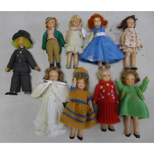 718 - Eight Rosebud composition dolls, circa 1930's-1940's and a wooden doll