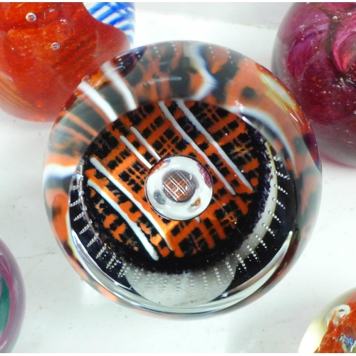 722 - Five glass paperweights including Caithness