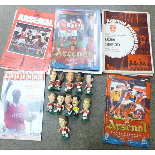 735 - Football programmes; Arsenal home and away programmes (34 no.) and eleven figurines of Arsenal Invin... 