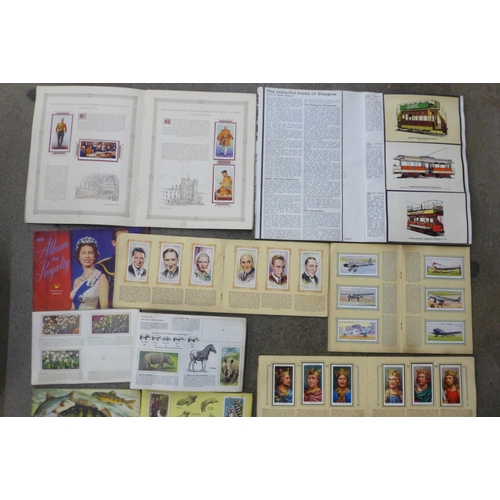 738 - A collection of cigarette and tea cards, some part albums and a collection of loose cigarette and te... 