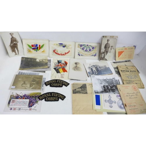 739 - Militaria; military postcards, ration books, etc.