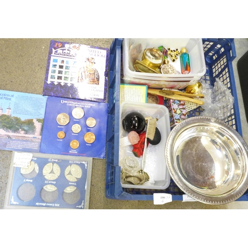 770 - A silver plated bowl, coin sets and other items including buttons, perfume bottles, etc.