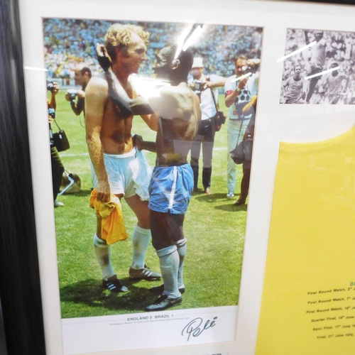 803 - A framed replica Brazil 1970 Mexico World Cup football shirt with Pele signature, with certificate o... 