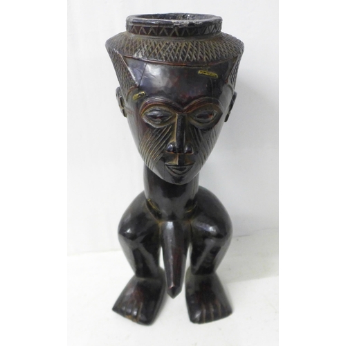 821 - A carved African Kuba palm wine cup