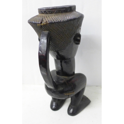 821 - A carved African Kuba palm wine cup