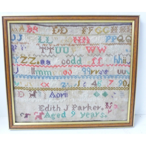 823 - A framed needlework sampler