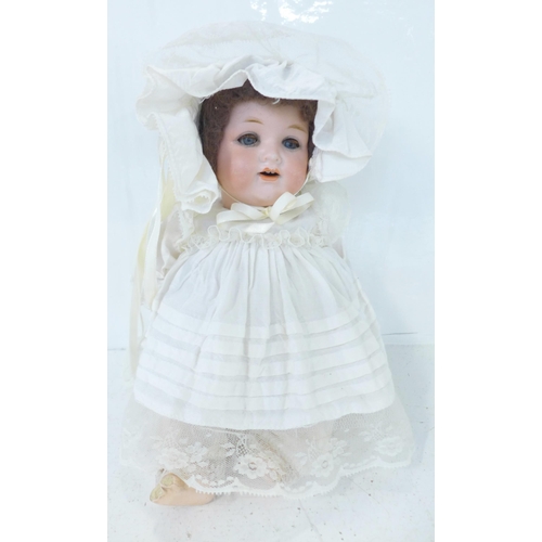 833 - A German Armand Marseille bisque head doll with blue sleep eyes, 990 O ½ M identification mark, circ... 