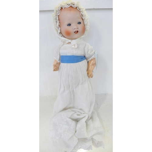 835 - A Japanese bisque head doll with blue sleep eyes, 500/4K identification mark, 1920's/30's, 45cm