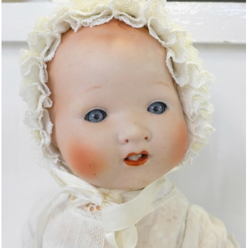 835 - A Japanese bisque head doll with blue sleep eyes, 500/4K identification mark, 1920's/30's, 45cm