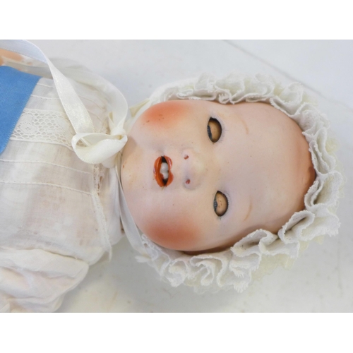 835 - A Japanese bisque head doll with blue sleep eyes, 500/4K identification mark, 1920's/30's, 45cm