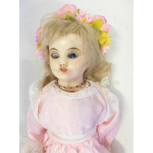 838 - A German wax over composition doll, one eye deteriorated, head restored, circa 1860-1890, 50cm