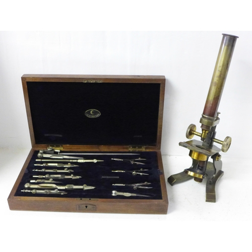 840 - A brass microscope and a cased set of Staedtler drawing instruments