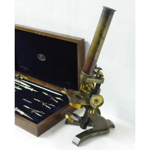 840 - A brass microscope and a cased set of Staedtler drawing instruments