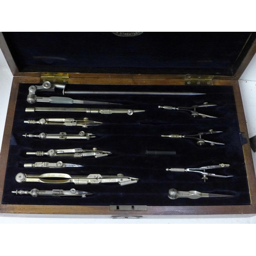 840 - A brass microscope and a cased set of Staedtler drawing instruments