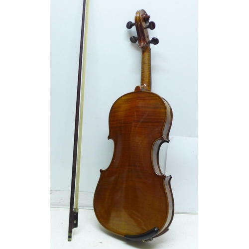 846 - A violin, the back 335mm without button, no paper label, with bow and case