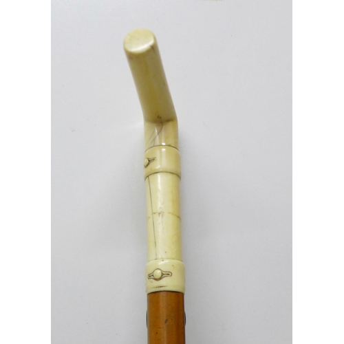 852 - A 19th Century gentleman's walking stick, the L-shaped ivory handle carved with faux buttoned straps... 