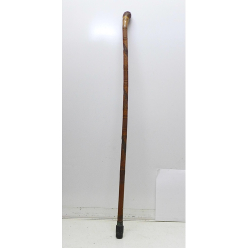 854 - A bamboo walking stick with Japanese carvings, Geisha girls, 89cm