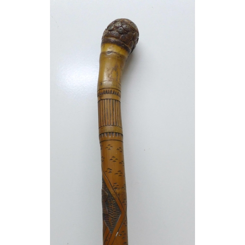 854 - A bamboo walking stick with Japanese carvings, Geisha girls, 89cm