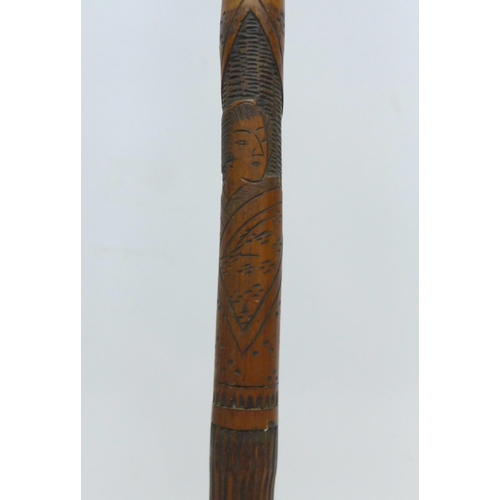 854 - A bamboo walking stick with Japanese carvings, Geisha girls, 89cm