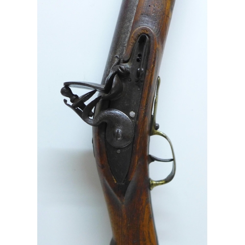 860 - An 18th Century flintlock blunderbuss, 48mm wide at mouth, the lock plate engraved Staples, brass tr... 