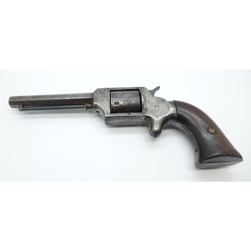 863 - A 19th Century revolver handgun, indistinct four digit number on the bottom of the grip, ??74, lengt... 