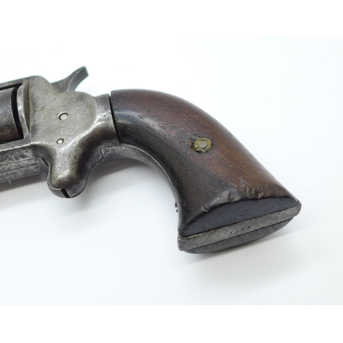 863 - A 19th Century revolver handgun, indistinct four digit number on the bottom of the grip, ??74, lengt... 