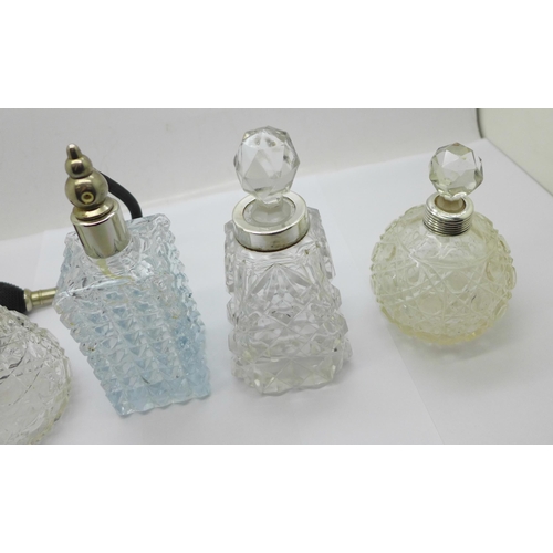 874 - Four glass scent bottles, (one lacking stopper, one lacking screw top with replacement stopper)