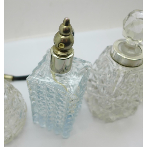 874 - Four glass scent bottles, (one lacking stopper, one lacking screw top with replacement stopper)